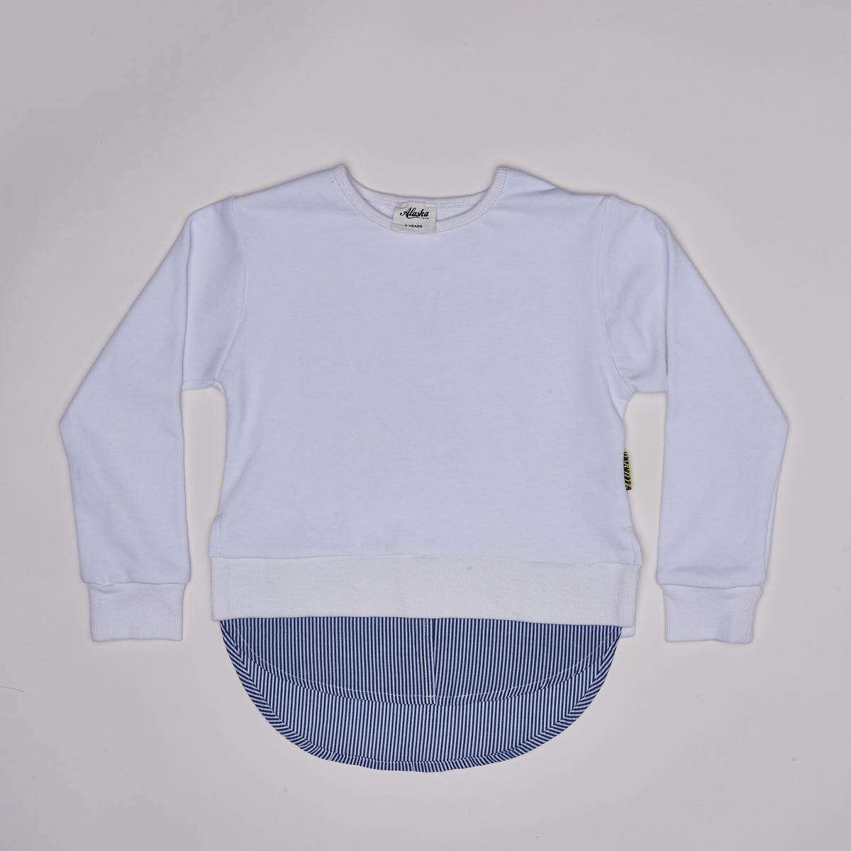 girl white sweater with blue striped hem
